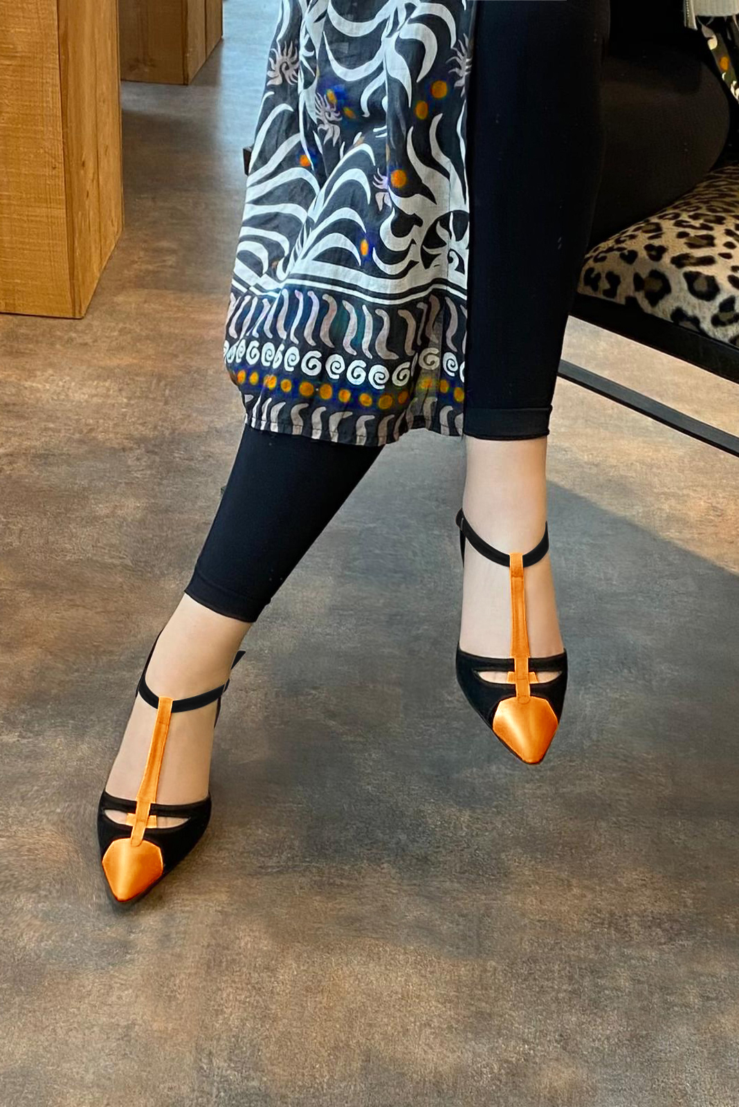 Apricot orange and matt black women's T-strap open side shoes. Tapered toe. Medium flare heels. Worn view - Florence KOOIJMAN